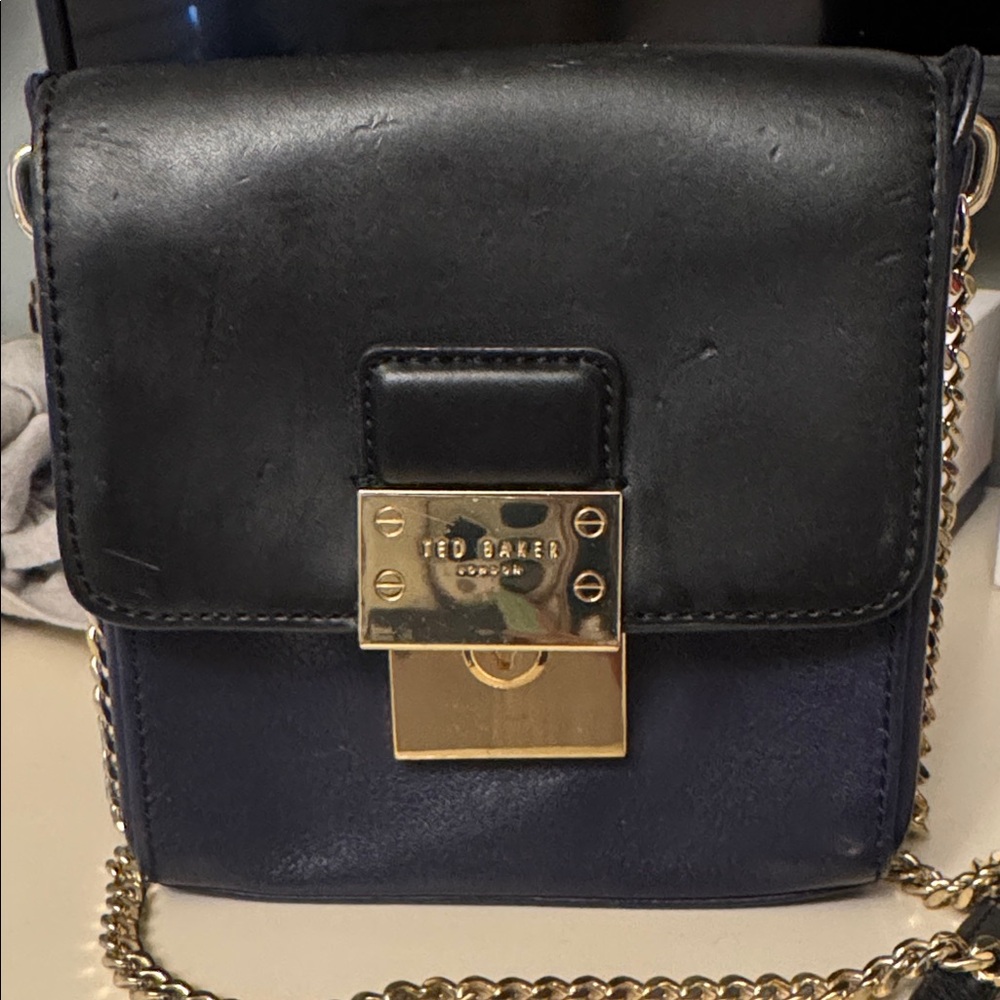 Ted Baker Black and Gold Crossbody Bag with Flap Closure